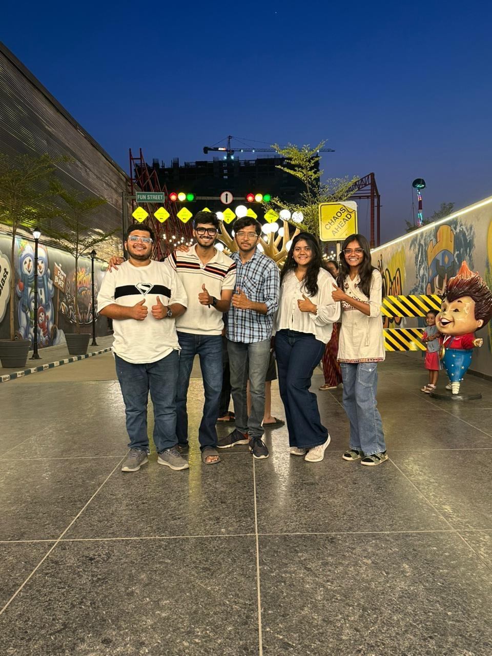 Team at an evening theme park